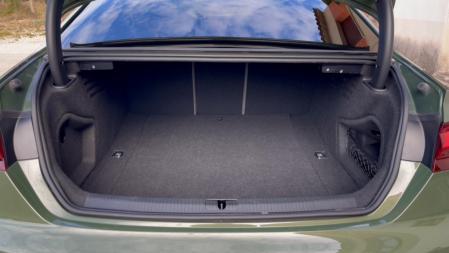 The trunk is not very high, but it has a good depth and width.  It can also be expanded with a remote knockdown system.